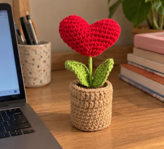 Handmade crochet red heart pot magnet with green leaves