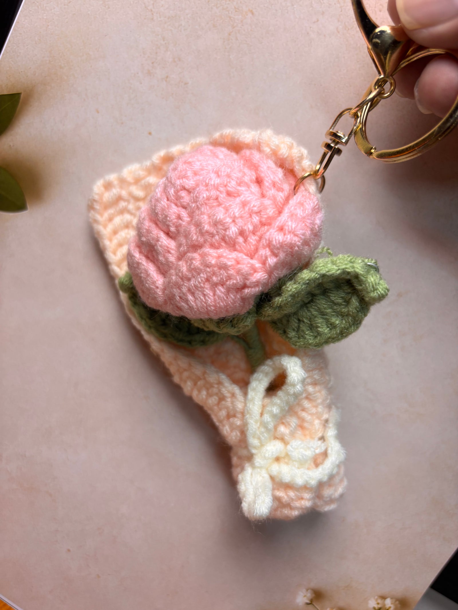 Handmade crochet pink rose bouquet keychain with cream wrap and bow